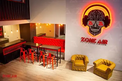 a restaurant with a bar with a skull on the wall at Appartement ZAHRA HOME in Marrakech