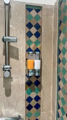 a bathroom with a counter with a sink in a room at Modern apartment in City center in Marrakech