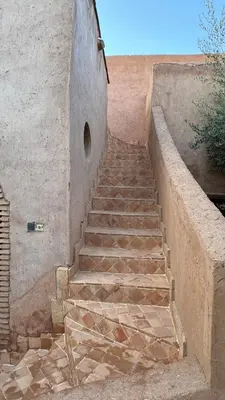 a set of stairs leading up to a building at DAR EL KERMA Traditional Rustic House in Châba