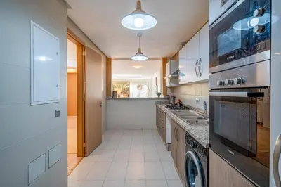 a kitchen with a sink and a stove at Your Haven of Peace with Private Jacuzzi in Marrakech