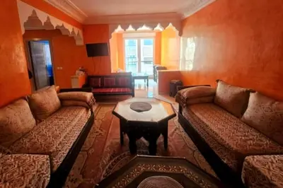 a living room with two couches and a coffee table at Charme & Confort -2 Chambres-Wifi-Azar in Marrakech