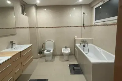 a bathroom with a toilet and a tub and a sink at Charme & Confort -2 Chambres-Wifi-Azar in Marrakech