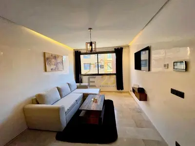 a living room with a couch and a coffee table at Appartement 2 chambres Résidence Atlassi derrière Carré Eden en plein coeur de Gueliz in Marrakech