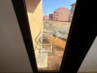 a view of a window with a chair on a building at Appartement 2 chambres Résidence Atlassi derrière Carré Eden en plein coeur de Gueliz in Marrakech
