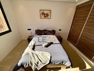 a bedroom with a large bed in a room at Appartement 2 chambres Résidence Atlassi derrière Carré Eden en plein coeur de Gueliz in Marrakech
