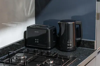 a toaster and a coffee maker sitting on a kitchen counter at Stayin 3Bedroom Duplex in Marrakech