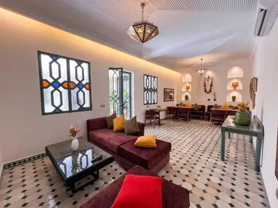 a living room with a couch and a table at Riad Kech One & Spa in Marrakech