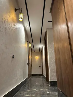 a hallway of an office building with a hallway at Appart haut standing - centre ville in Marrakech