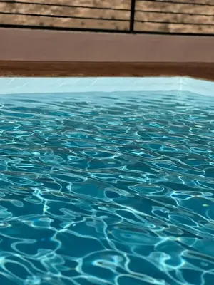 a close up of a pool of blue water at Appart haut standing - centre ville in Marrakech