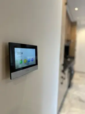 a tv on a wall in a room at Appart haut standing - centre ville in Marrakech