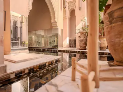 a room with a pool of water and some plants at Riad Mayan & Spa in Marrakech