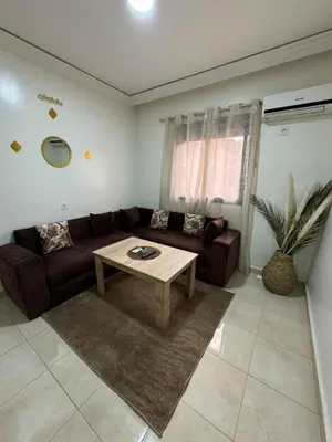 a living room with a couch and a coffee table at Beautiful Luxurious 2-bedroom with Wi-Fi Gueliz, Marrakech in Marrakech