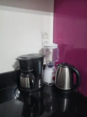 a coffee maker and a blender on a counter at Marrakech héberg in Marrakech