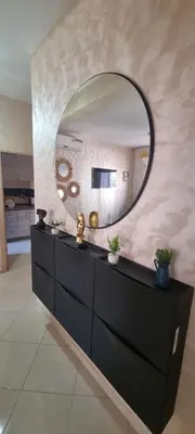a mirror on top of a dresser in a room at Cozy appartement à Marrakesh in Marrakech