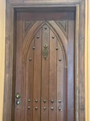 a wooden door with a design on it at charmant appartement avec grande piscine & terrasse in Marrakech