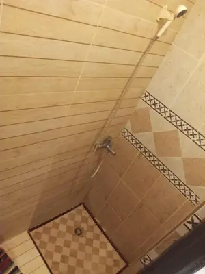 a shower in a bathroom with a ceiling at appartement 6 min centre terrasse in Marrakech
