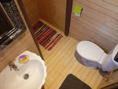 a bathroom with a white toilet and a sink at appartement 6 min centre terrasse in Marrakech
