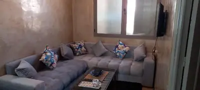 a living room with a couch and a table at Studio Rmila 1 in Marrakech