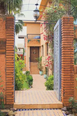 an entrance to a house with a gate at Amlkis golf royal in Marrakech