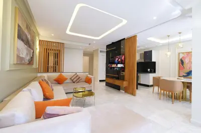 a living room with a couch and a table at Awesome Luxury Apartment in Marrakech in Marrakech
