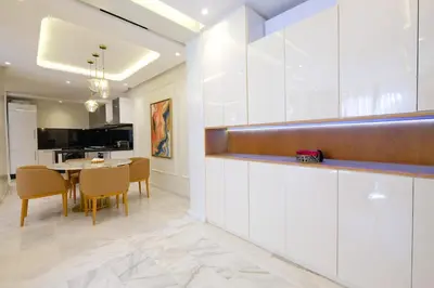 a kitchen and dining room with a table and chairs at Awesome Luxury Apartment in Marrakech in Marrakech