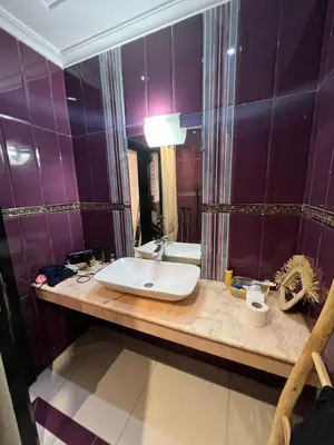 a bathroom with a sink and a mirror at Villa Riad Jawhar & SPA in Marrakech