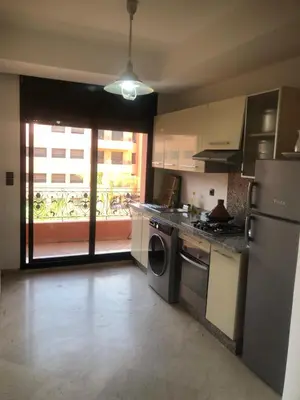 a kitchen with a washer and dryer and a window at - Résidence Babylone Y - 1 Bedroom Appartement in Marrakech