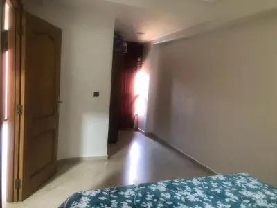 an empty room with a bed and a window at - Résidence Babylone Y - 1 Bedroom Appartement in Marrakech