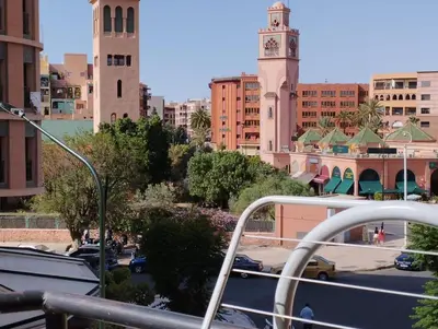 a view of a city with a clock tower at زنقة ابو حنيفه in Marrakech