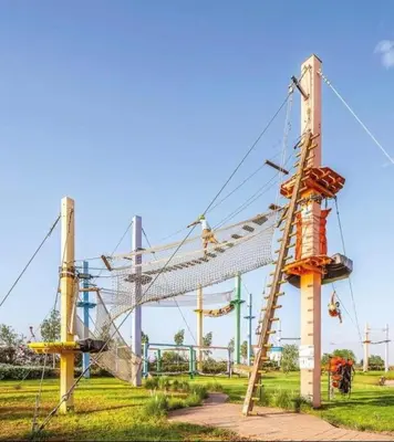 a roller coaster at a amusement park at Appartement moderne et chic, avec piscine pour femmes et Parc de jeux in Dar Caïd Layadi