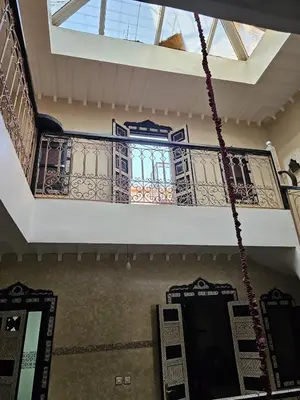 a room with a balcony with a window at Bienvenus dans un beau nouveau Riad Tout Entier pour vous in Marrakech