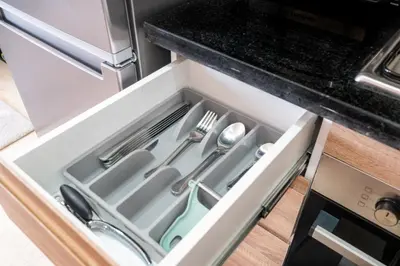 a kitchen drawer with utensils in it at Élégant avec Parking - Guéliz Hivernage in Marrakech
