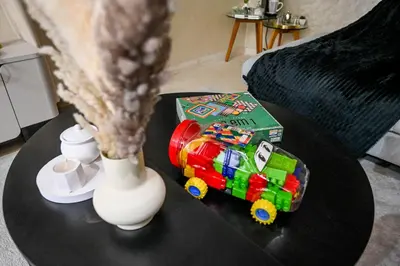 a table with a lego train toy next to a vase at Élégant avec Parking - Guéliz Hivernage in Marrakech
