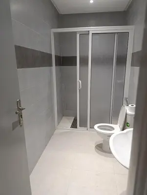 a bathroom with a toilet and a sink at Excellente appartement 3 chambres in Marrakech
