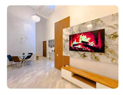 a living room with a fireplace in the wall at Spacious apartment in Marrakech in Marrakech