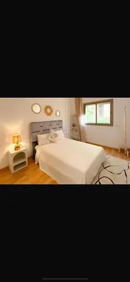 a bedroom with a large white bed and a window at Spacious apartment in Marrakech in Marrakech