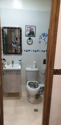 a bathroom with a toilet and a sink at Portes de Guéliz in Marrakech