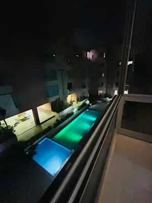 an overhead view of a swimming pool at night at Le saphir home in Marrakech