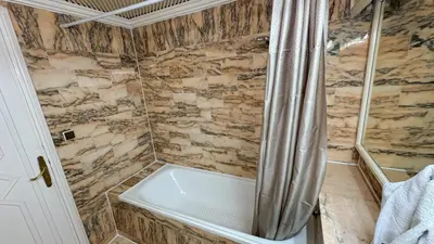 a bathroom with a shower with a bath tub at Modern Apartment in a Resort Luxury and Comfort in Marrakech