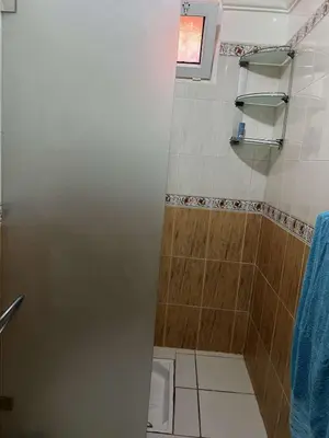 a bathroom with a shower stall and a toilet at Palm Residence in Marrakech