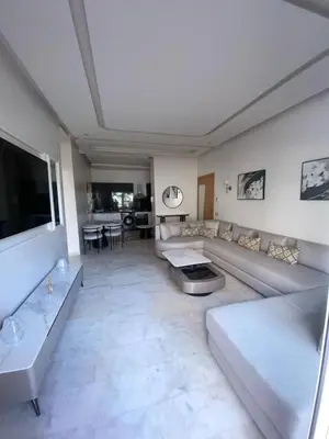 a large living room with couches and a television at Riad Garden 1 in Marrakech