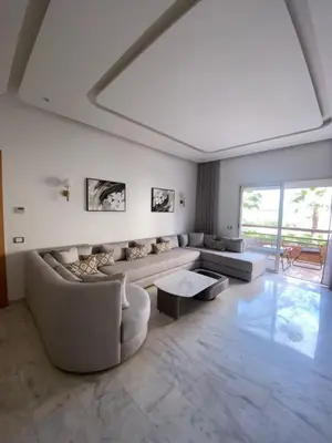a living room with a couch and a table at Riad Garden 1 in Marrakech