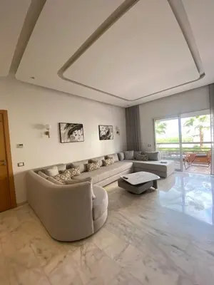 a living room with a couch and a table at Riad Garden 1 in Marrakech