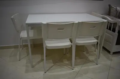 a white table and chairs in a room at Apartment A Zaitone G19 in Marrakech