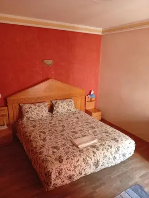 a bedroom with a bed with a book on it at Appartement de luxe Résidence Majorelle in Marrakech