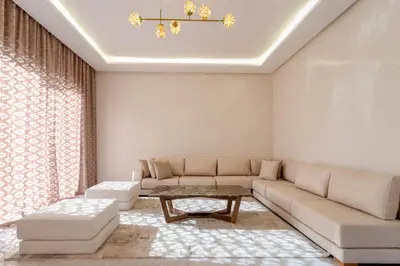 a living room with a couch and a table at Villa Esma in Marrakech