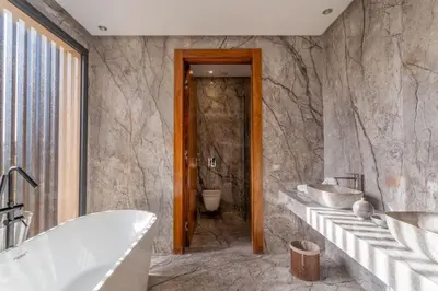 a bathroom with two sinks and a tub at Villa Esma in Marrakech