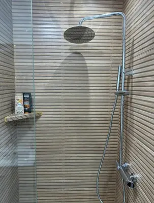 a bathroom with a shower with a shower head at Studio de luxe à Gueliz Marrakech in Marrakech