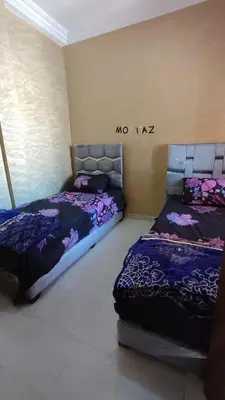 a bedroom with two beds in a room at Saada 15 marrakech in Marrakech