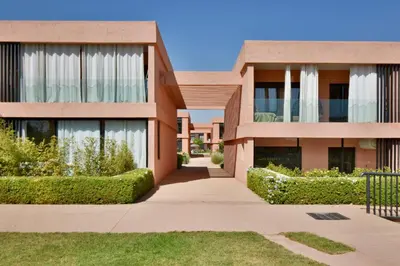 a building with a pathway in front of it at Appartement Domaine de Noria 7 in Marrakech